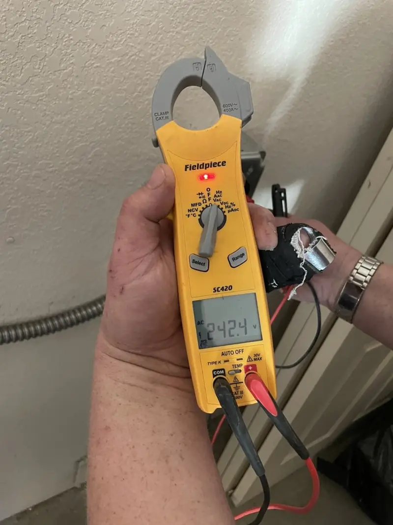 Voltage testing with clamp meter during Electrical Installation Services in Williamson